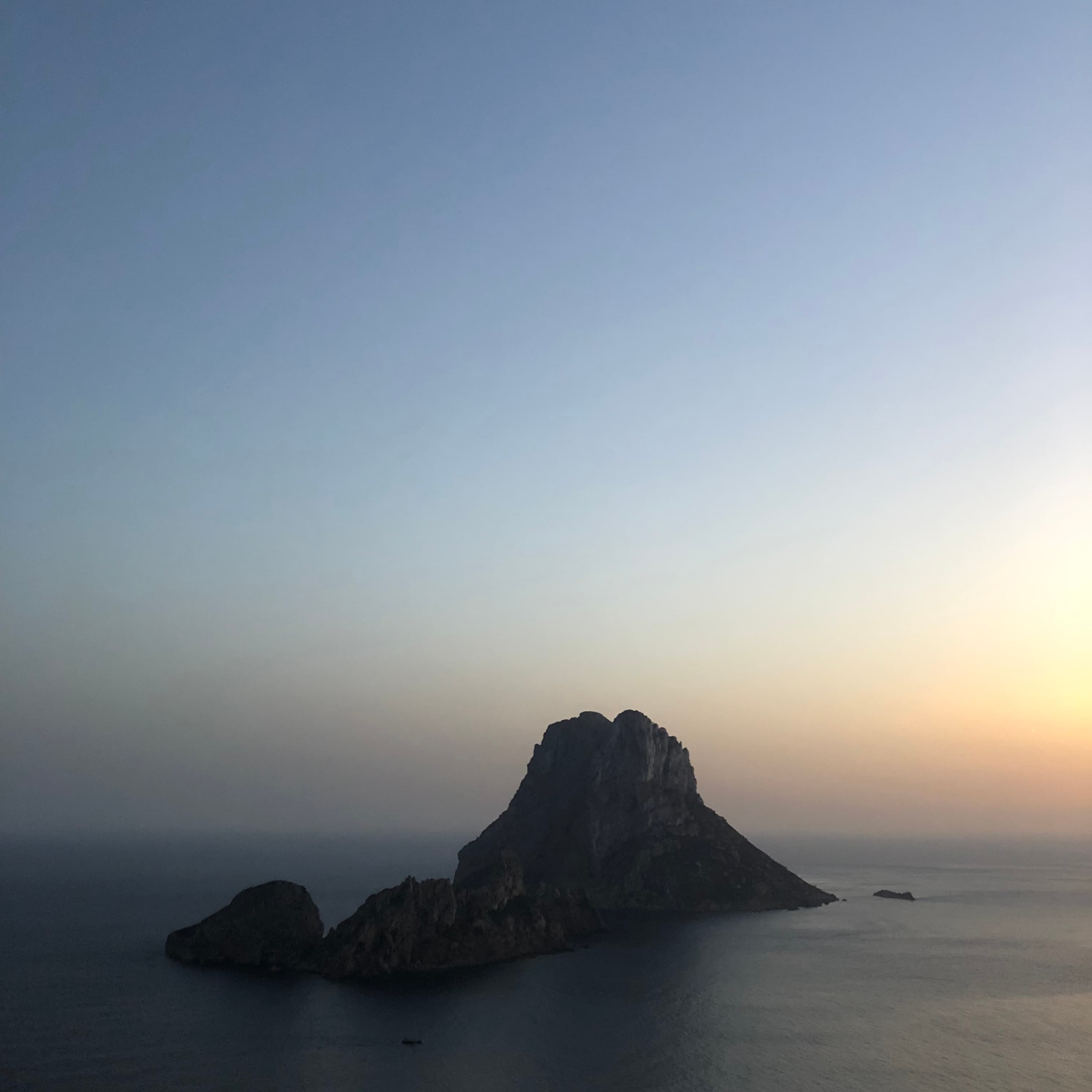 Atmospheric Ibiza horizon with calm sea at sunset